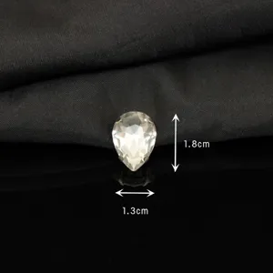 Clear pear shaped glass rhinestone crystal with metal claw setting for DIY crafts and clothing.