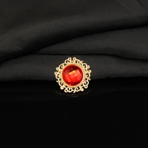 Exquisite gold-tone round red rhinestone decorative button, perfect for DIY crafts and accessories.