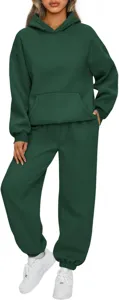Tuta da ginnastica da donna due pezzi in verde scuro con felpa con cappuccio e pantaloni.
