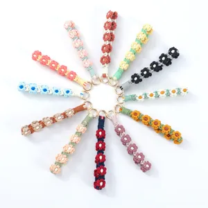 Correas de muñeca de margaritas tejidas a mano en varios colores para llaveros.