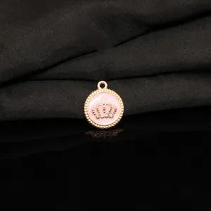 Gold alloy pink enamel crown pendant detail, DIY charm accessory for handmade jewelry.