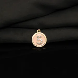 Gold tone alloy number 5 pendant charm with pink enamel and rhinestones for DIY jewelry.