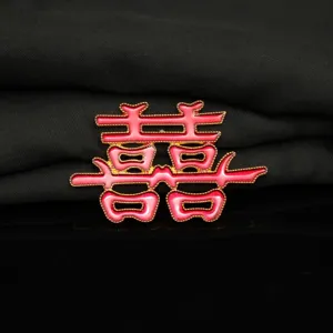 Close-up of the red enamel double happiness alloy accessory detail texture wedding DIY.