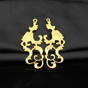 Close-up of gold hollow antique alloy cutout pendant charms for Hanfu hair accessories DIY.