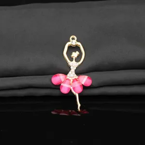 Close-up detail of the gold alloy crystal ballet dancer pendant with pink crystal skirt and rhinestones.