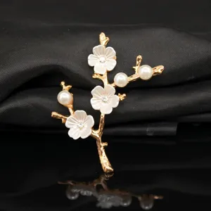 Exquisite alloy plum blossom branch accessory with pearls and rhinestones for DIY crafts.