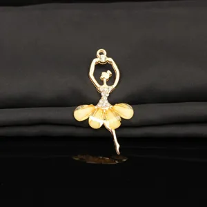 Gold alloy ballet dancer pendant with rhinestones and yellow skirt detail for DIY crafts.