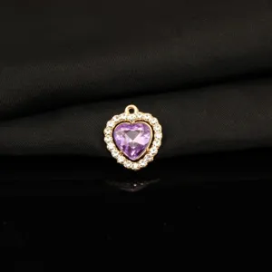 Close-up of alloy rhinestone purple heart pendant for DIY necklace bracelet accessory.