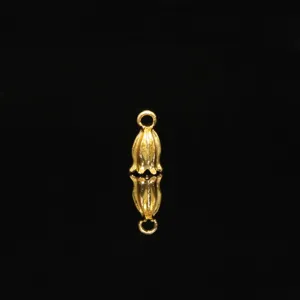 Gold lily of the valley flower bead cap pendant detail, metal DIY hair accessory.