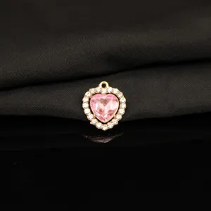 Close-up detail of heart shaped alloy rhinestone pendant pink crystal charm for jewelry making