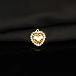 Gold tone alloy heart pendant charm with sparkling crystal rhinestones for DIY necklace making.