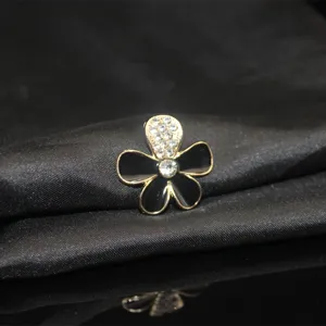 Fünfblättrige Blumen Legierung Strass Zubehör, schwarz und gold schick für Handys.