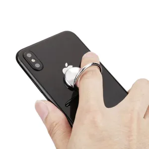 Close-up of silver metal phone ring holder with CD texture, 360 degree rotation feature.
