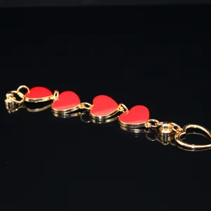 Gold alloy chain with red enamel heart charms, detailed view for DIY phone case accessories.