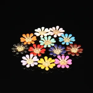 Detailed view of colorful enamel daisy alloy charms, ideal for DIY phone case decorations.