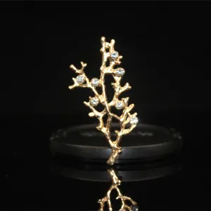 Gold alloy tree branch DIY jewelry accessory featuring sparkling crystal rhinestones close up