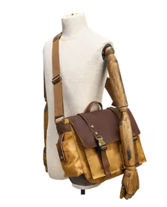 Sac bandoulière rétro pour homme en toile et cuir, sac messenger vintage avec lanière.