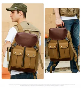 Detailed view of retro canvas backpack with dual front pockets and brown leather flap design.