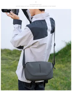 Grey crossbody camera bag for men, waterproof photography bag for 1 camera 2 lenses.