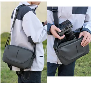 Detailed view of the men's grey camera sling bag showing daily carrying and storage capacity.