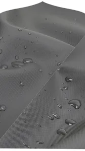 Close-up detail of durable waterproof fabric with water droplets showing water-resistant texture.