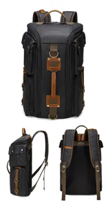 Detailed view of large capacity waterproof canvas backpack with multiple utility pockets for men.
