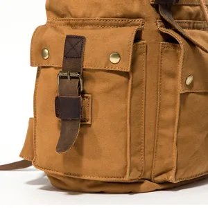 Vintage brown canvas backpack for men, durable leather straps, casual travel school bag.
