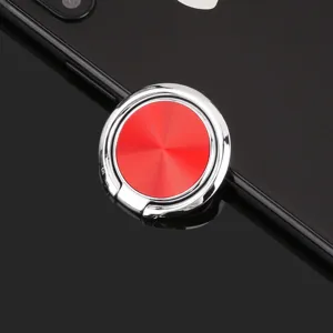 Detailed close-up of red CD texture phone ring holder bracket with metallic finish.