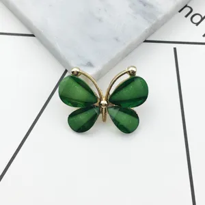 Green crystal butterfly alloy accessory detail shot for DIY crafts and phone case decoration.
