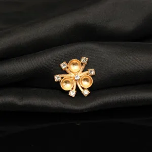 Detailed close-up of gold alloy flower DIY jewelry finding with crystal rhinestones for crafts.
