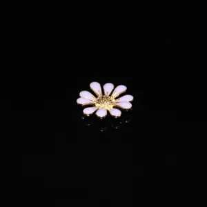 Gold-tone alloy white enamel daisy flower charm detail shot for DIY crafts phone case decor