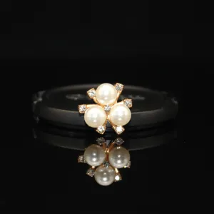 Alloy pearl flower DIY accessory detail shot, sparkling rhinestones for handmade crafts.