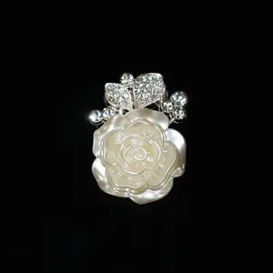 Detailed close-up shot of a delicate white rose rhinestone alloy DIY shoe charm accessory.