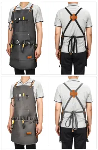 Durable work apron with multiple tool pockets, cross-back straps, and heavy-duty leather design.