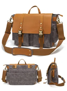 Detail view of retro canvas messenger bag with brown leather flap and adjustable shoulder strap.