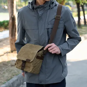 Sac bandoulière appareil photo en toile pour homme, sac messager rétro et durable.