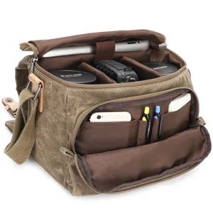 Waterdichte vintage canvas DSLR fototas met verstelbare verdelers en opbergvakken.