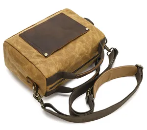 Vintage waxed canvas crossbody bag, detailed view of men's casual shoulder and handbag design.