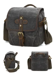 Vintage canvas crossbody camera bag retro photography shoulder bag with leather trim and brass buckles.