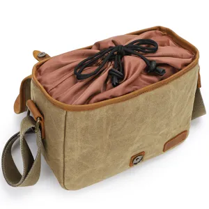 Vintage canvas DSLR camera bag shoulder messenger bag with drawstring inner lining and leather trim.