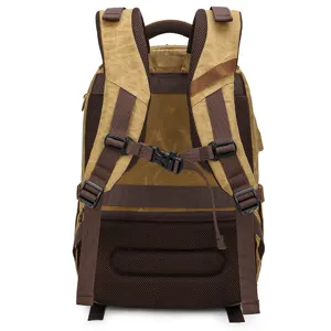 Vintage canvas camera backpack with breathable mesh back, durable travel daypack for outdoors.