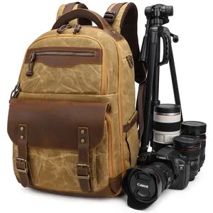 Vintage canvas DSLR camera backpack, waterproof travel rucksack with padded inserts for gear.