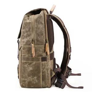 Vintage canvas camera backpack with multi-functional compartments and durable straps.