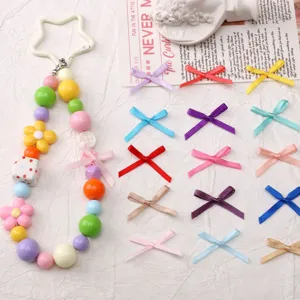 Fiocchi colorati e cordino di perline accessori fai da te per forcine fatte a mano e decorazioni.