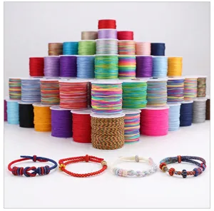Multi-color DIY nylon cord spools set with handmade braided bracelets for craft jewelry making.