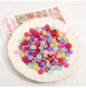 Close up detail shot of colorful acrylic flower spacer beads, perfect for DIY jewelry craft.