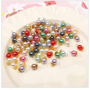 Colorful glass imitation pearl charms with gold loops for DIY jewelry making and crafts.
