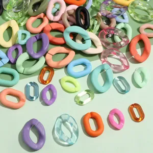 Colorful acrylic open jump rings and U-shaped chain links for DIY jewelry making accessories.