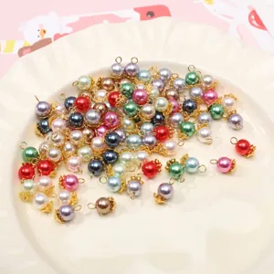 Colorful glass pearl charms with gold loops for DIY handmade jewelry bracelets crafting.