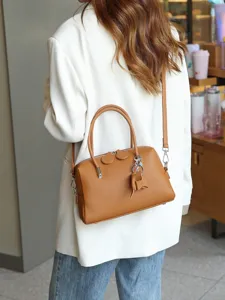 Genuine leather Boston handbag for women, elegant brown top layer cowhide shoulder crossbody bag.